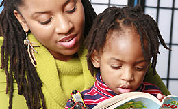 Mother reading to son